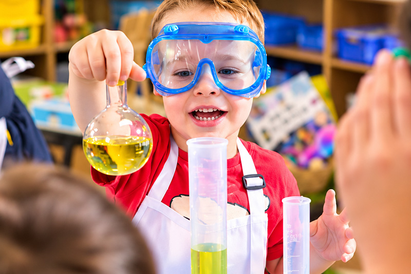 Young boy learning about science - STEAM