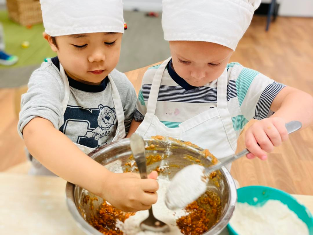 Cooking our own carrot cake with fresh produce at Imagine Childcare and Kindergarten Southport